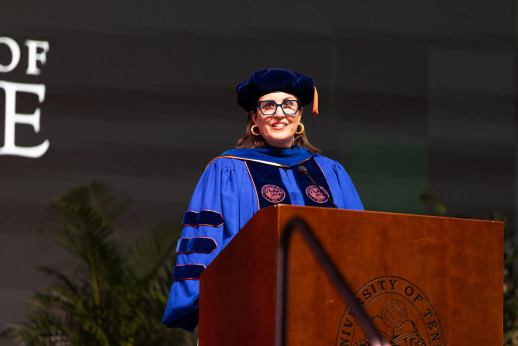 Vice Provost and Dean of the Graduate School Van Puymbroeck speaking at the podium.