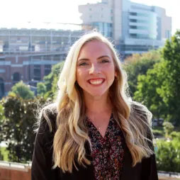 woman with Neyland Stadium in the background